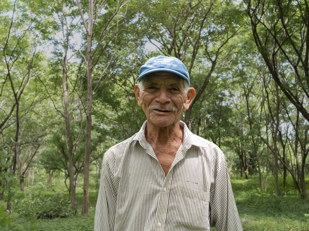 Photo of a farmer in the CommuniTree Carbon Program. 